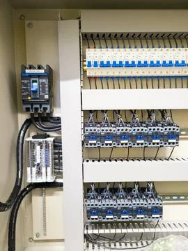 Industrial electrical control panel with wiring and circuit breakers Stock Photos