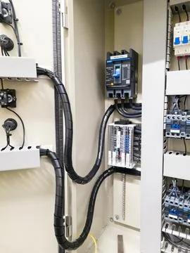 Industrial electrical control panel with wiring and circuit breakers Stock Photos
