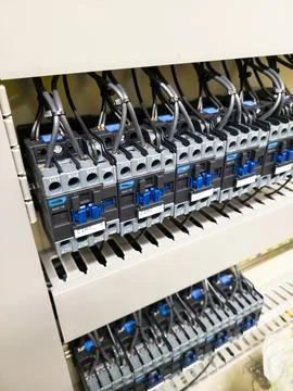 Industrial electrical control panel with wiring and circuit breakers Stock Photos