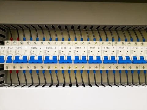 Industrial electrical control panel with wiring and circuit breakers Stock Photos