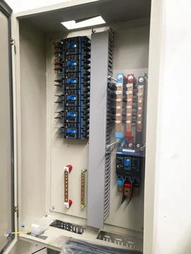 Industrial electrical control panel with wiring and circuit breakers Stock Photos