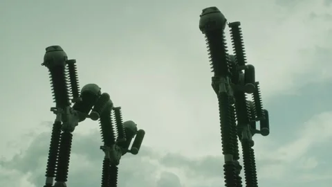 Industrial Electrical Insulators Against Cloudy Sky Stock Footage 300267976