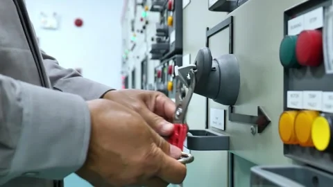 Industrial electrical maintenance worker checking power at an electrical panel a 動画素材 343904505