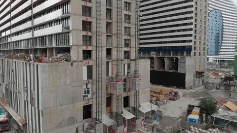 Industrial elevator on outside of skyscraper during new construction Stock Footage 123903780