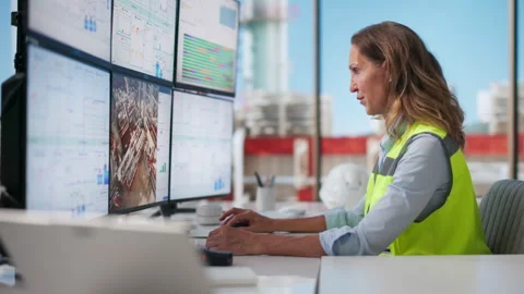 Industrial Engineer Analyzes Real-time SCADA Data Stock Footage 336370996