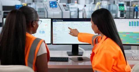 Industrial Engineer Analyzes Real-time Data To Improve Factory Automation Eff Stock Photos