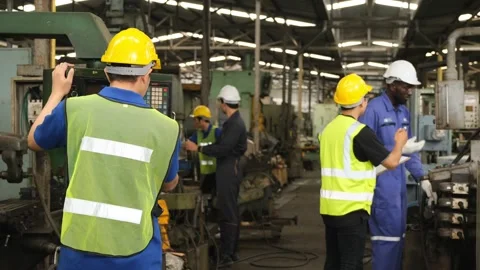 Industrial engineer checking work of caucasian factory worker team. Stock Footage 141235890