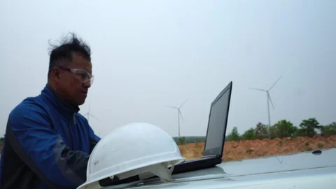 Industrial engineer in hard hat wearing wafety jacket uses touchscreen tablet  Video stock 127920001