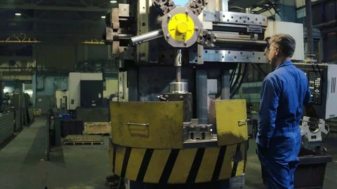 Industrial engineer making test control on modern equipment finished metal parts Stock Footage