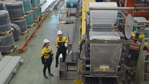 Industrial engineer men, women using tablet for working whlie walking at factory Video stock 242106357