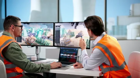 Industrial Engineer Monitors Predictive SCADA Software On Laptop Stock Footage 347902957