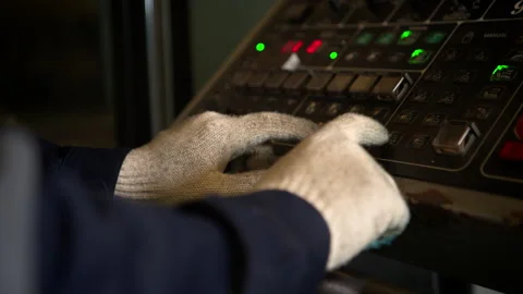 An industrial engineer stands in front of a control panel Stock Footage 339080585
