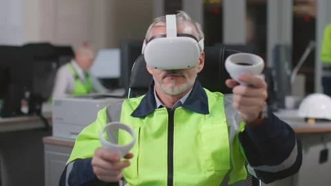 Industrial engineer testing augmented reality headset and joystick Stock Footage 200453666