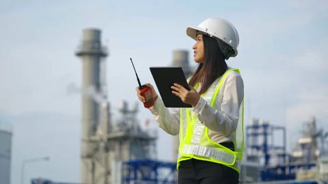Industrial engineer using digital tablet for work against the electrical plant. Stock Footage 232505252
