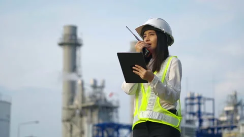 Industrial engineer using digital tablet for work against the electrical plant. Stock Footage 233283488
