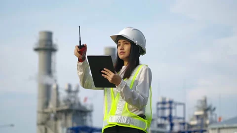 Industrial engineer using digital tablet for work against the electrical plant. Stock Footage 233283816