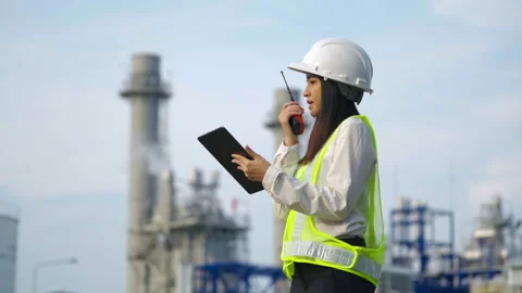 Industrial engineer using digital tablet for work against the electrical plant. Stock Footage 233284087