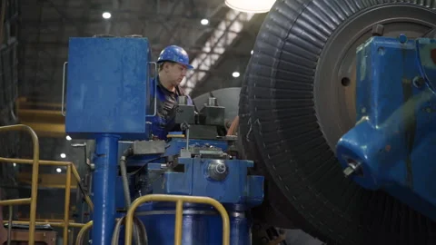 Industrial Engineer Worker Checks Rotating Mechanical Gas Turbine Engine Video stock 271148143