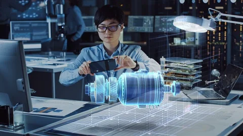 Industrial Engineer Works with Smartphone Using Augmented Reality Holographic Stock Footage 116721190
