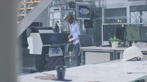 In Industrial Engineering Facility: Female Architect Prints Drafts of Engine Video stock 107782887