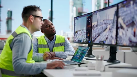 Industrial Engineers Analyze Real-time 3D Twin Simulation Stock Footage 345312043