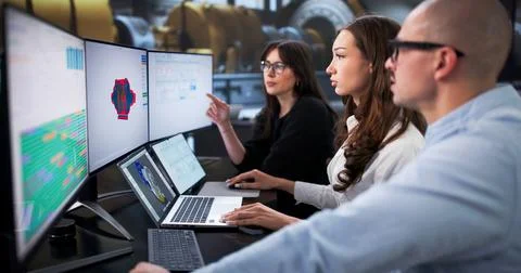 Industrial Engineers Using 3D Software To Do Gas Turbine Maintenance. Stock Photos