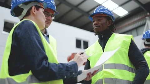 Industrial engineers working inside automation and robotics factory - Industry Stock Footage 212683203