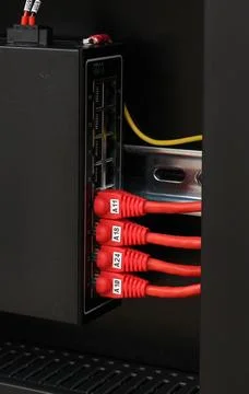 Industrial Ethernet Data Switch with Rj45 connector cables attached. Stock Photos