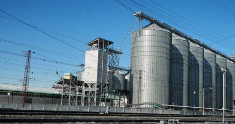 Industrial facilities. Elevator building with huge grain storage tanks. Video stock 235916008