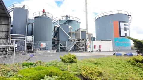 An industrial facility with large grey storage tanks Stock Footage 327161016