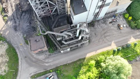 Industrial facility with large pipes and machinery shown from above Video stock 335680835