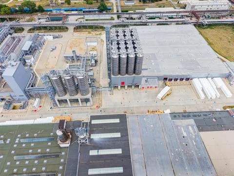 Industrial facility in operation with large storage tanks and manufacturing.. Stock Photos