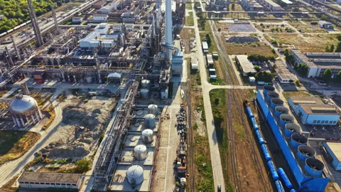 Industrial facility shows large machinery and equipment operating under clear Stock Footage 344241353