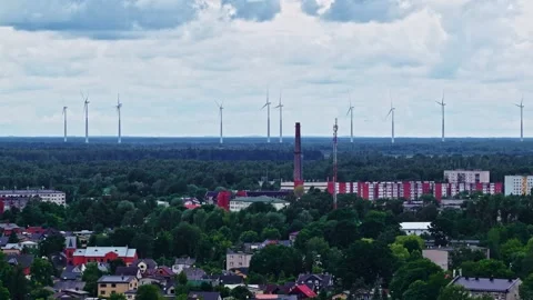 Industrial Facility With Trees And Wind Turbines In Background Stock Footage 339646784