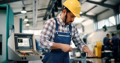 Industrial factory employee working in metal manufacturing industry Видео 78986608