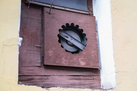 Industrial fan mounted in a window using a DIY chipboard panel with drilled.. Stock Photos