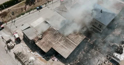 Industrial fire aftermath Firefighters work Stock Footage 303309634