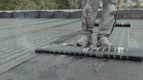 Industrial flat roofing waterproofing system, installed by professionals with Stock Footage 197416364