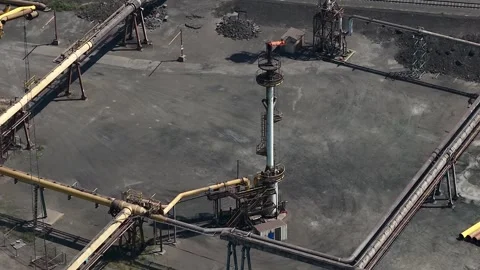 Industrial gas flare stack burning excess gases aerial view Stock Footage 340963417