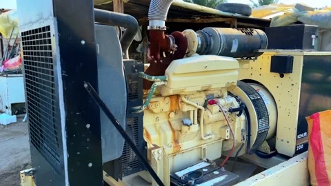 Industrial Generator Close-Up in 4K: Mechanical Precision in Rustic Setting. Stock-Footage 307443355