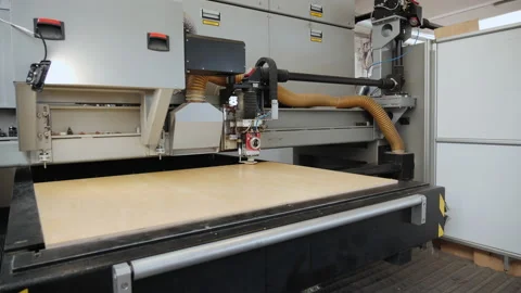 Industrial grade laser cutter working on plywood sheet - medium close Video stock 157967902