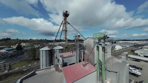 Industrial Grain Processing Facility With Silos And Conveyors. orbiting drone Stock Footage 308941640