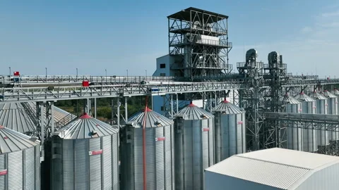 Industrial grain silos and processing plant. A large industrial facility with Stock Footage 289875188