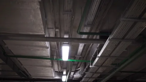 Industrial heating pipes under ceiling or another household communications Stock-Footage 129854430