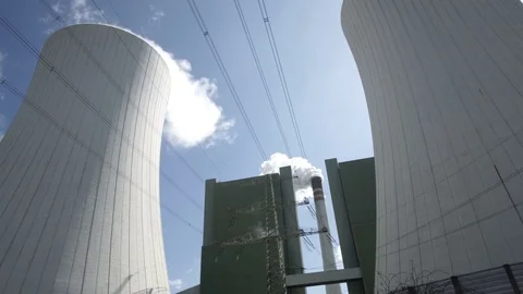 Industrial Installation With Smoke Stack and Cooling Tower Closeup Tilt Up Stock Footage 74653965
