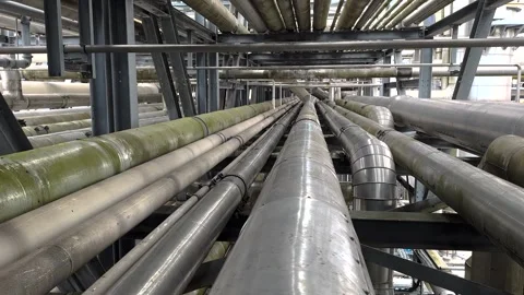 Industrial interior. Close-up of many pipes in part of a pipe rack Stock Footage 301694543