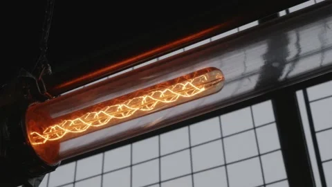 Industrial interior detail of glowing Edison light bulb Stock Footage 334732453