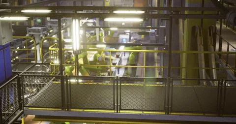 Industrial interior of a modern facility featuring machinery and robotics Stock Illustration