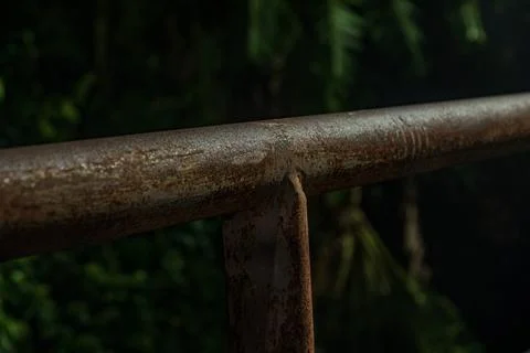 Industrial iron rust texture on railing steel infrastructure near midnight Stock Photos