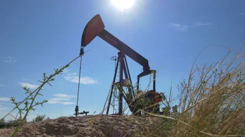 Industrial jack pump platform working on oil field in Texas Stock Footage 62221207